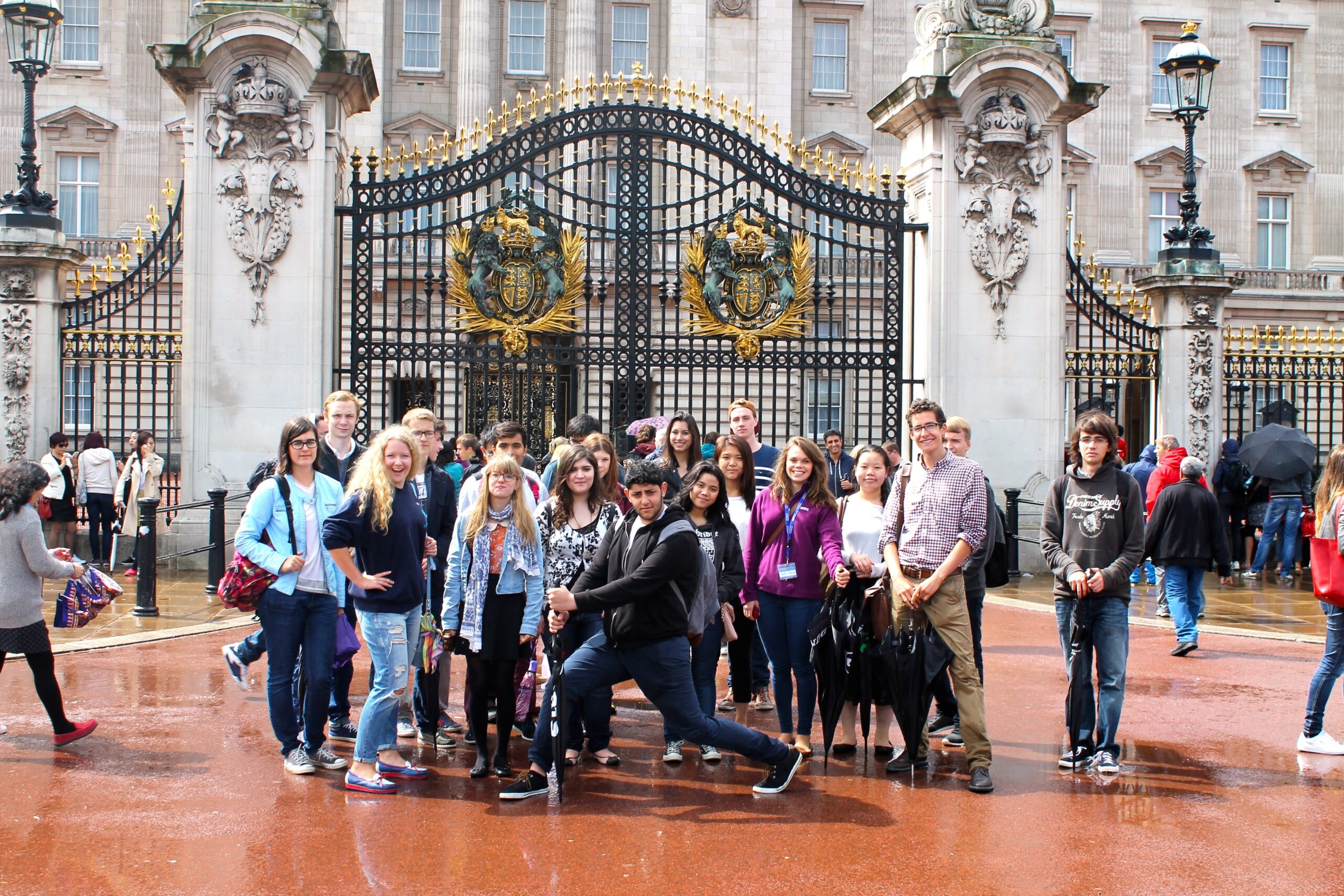 Students standing outside Buckingham Palace during the summer